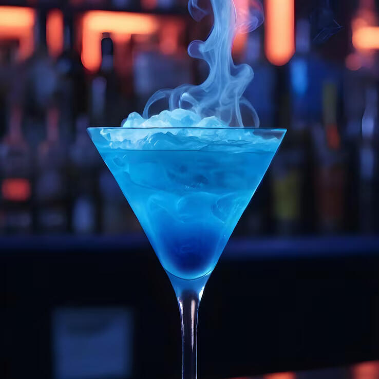 ❶⤴ A delicious blue vodka-based cocktail rimmed with sugar and glow cube set to blue.
